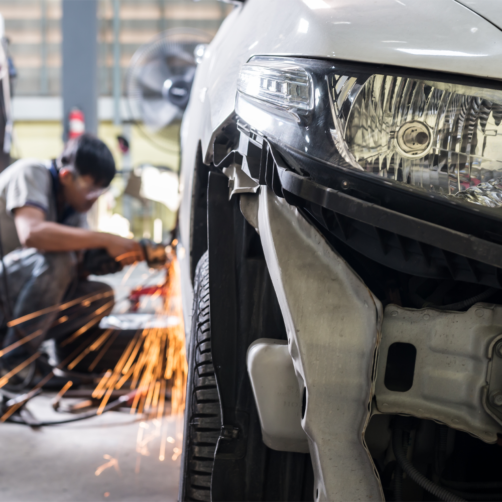 Technician working on vehicle