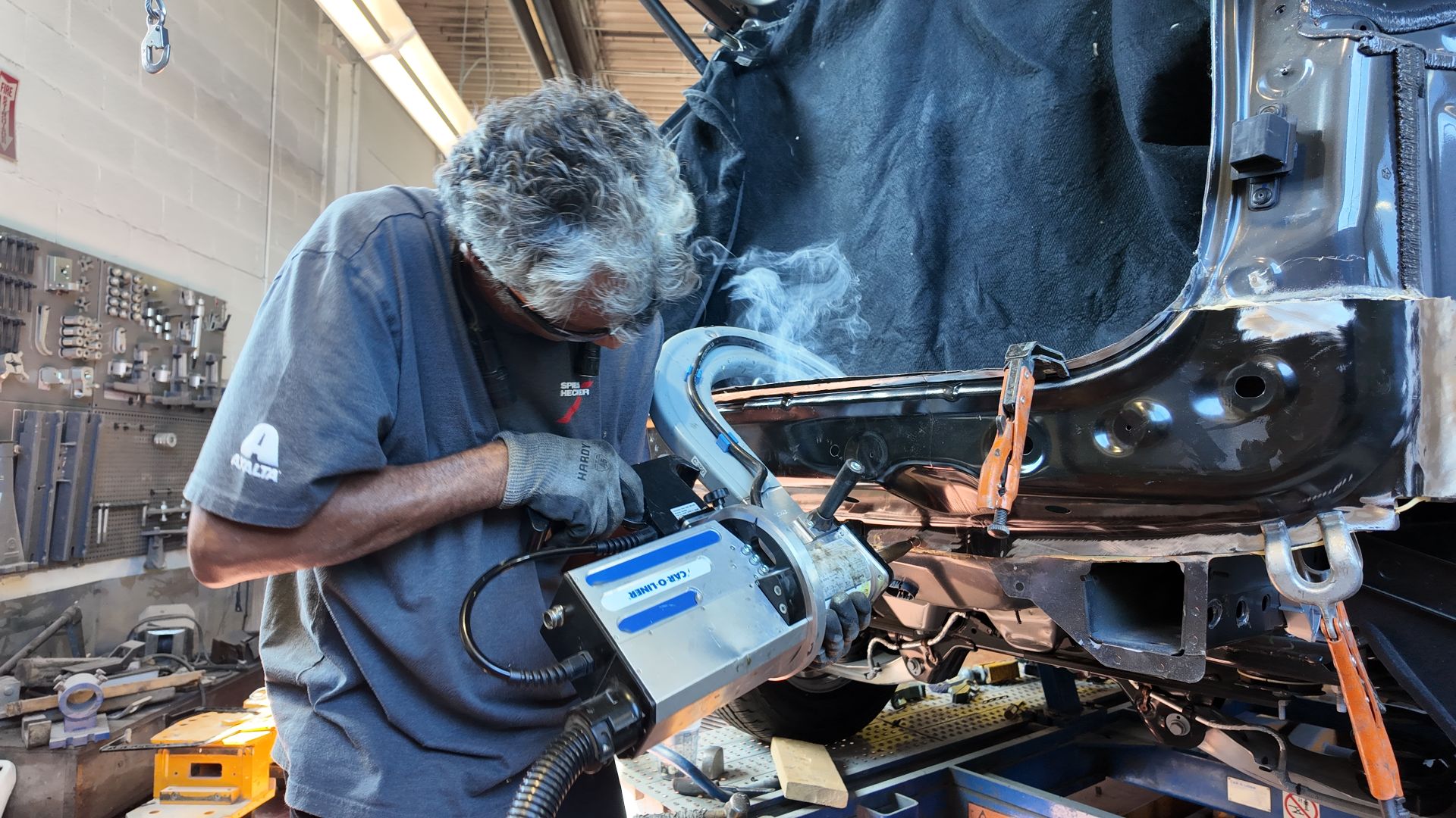 Technician working on vehicle